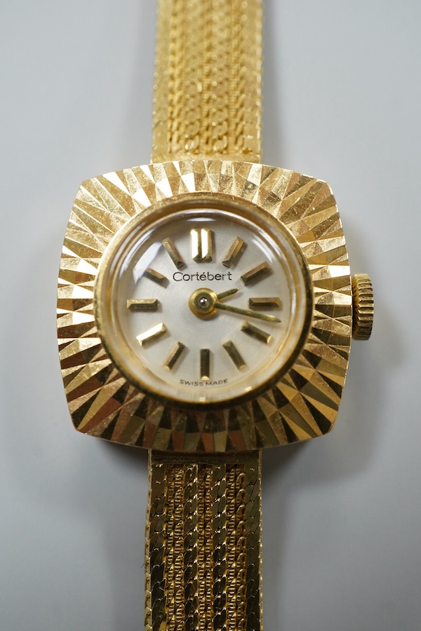 A lady's modern 18ct gold Cortebert manual wind wrist watch, with baton numerals, on 18ct gold integral strap, case diameter 18mm, overall length 17.7cm, gross weight 22 grams.